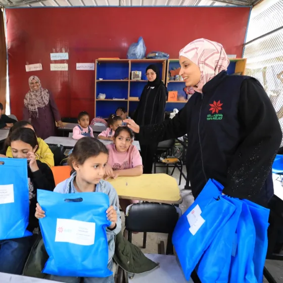 Stationery distribution in a classroom, Gaza Strip